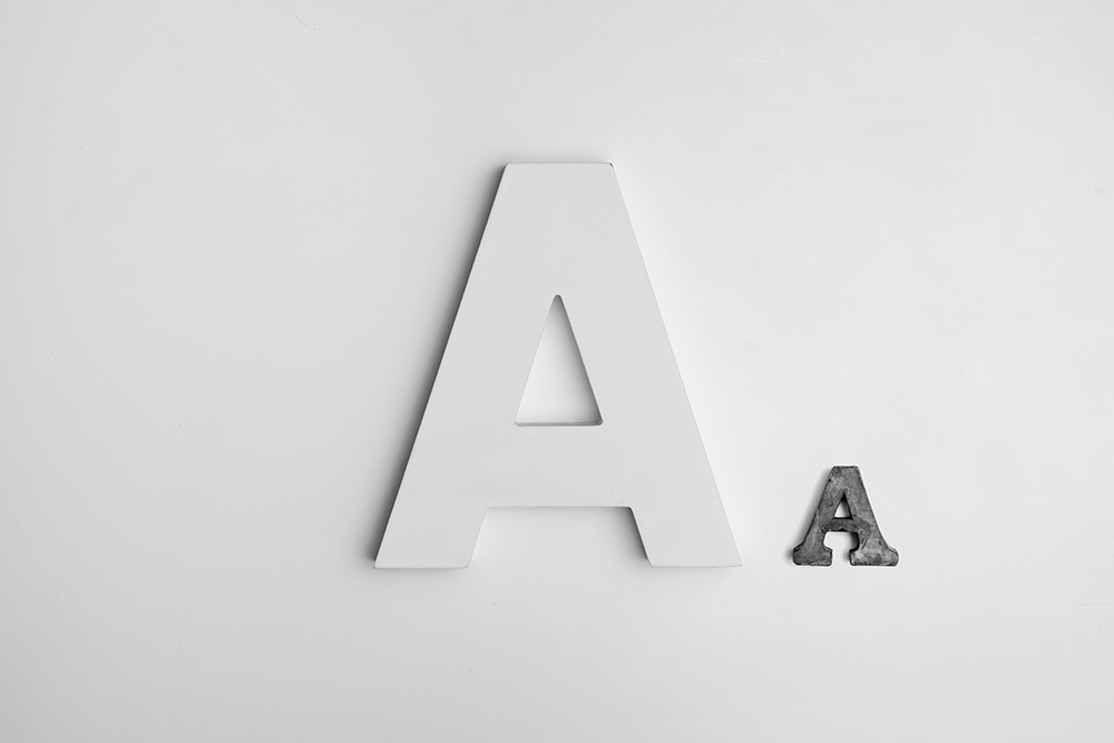 Two letter 'A' characters in different sizes and materials, representing bold and creative typography in modern web design.