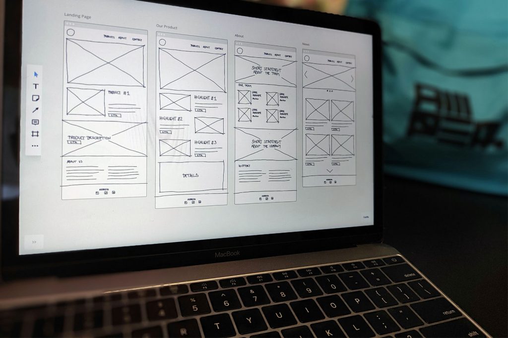 Wireframes of a website on a laptop